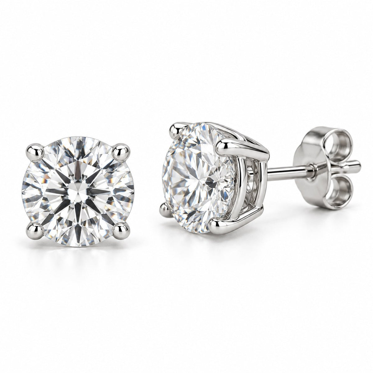 Moissanite stud earrings in a four-prong white metal setting